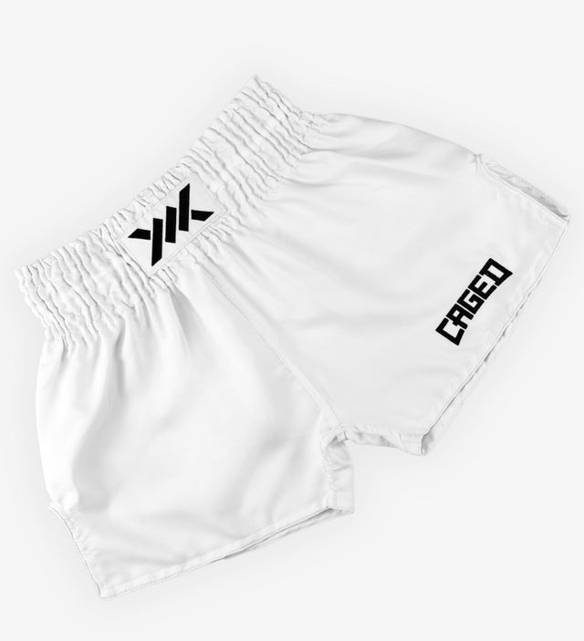 Spodenki Muay Thai Caged Classic – Białe/Czarne