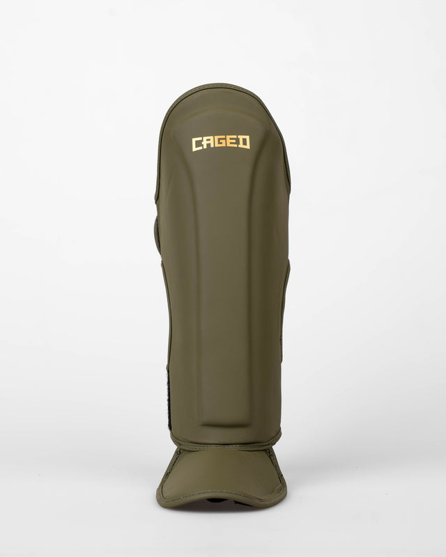 Caged Schienbeinschoner Spark Kinder – Khaki/Gold