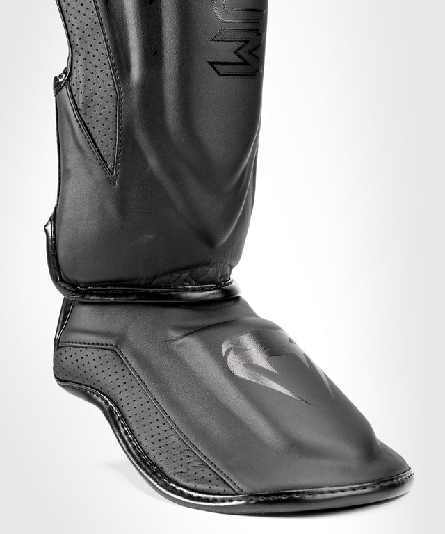 Espinilleras Venum Elite Evo – Negro/Negro
