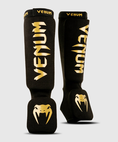 Caneleiras de kickboxing Venum Kontact – Preto/Ouro