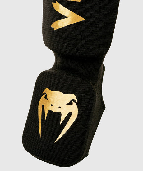 Caneleiras de kickboxing Venum Kontact – Preto/Ouro