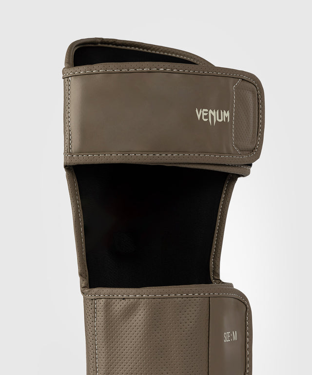Espinilleras Venum Impact Evo Scales – Marrón