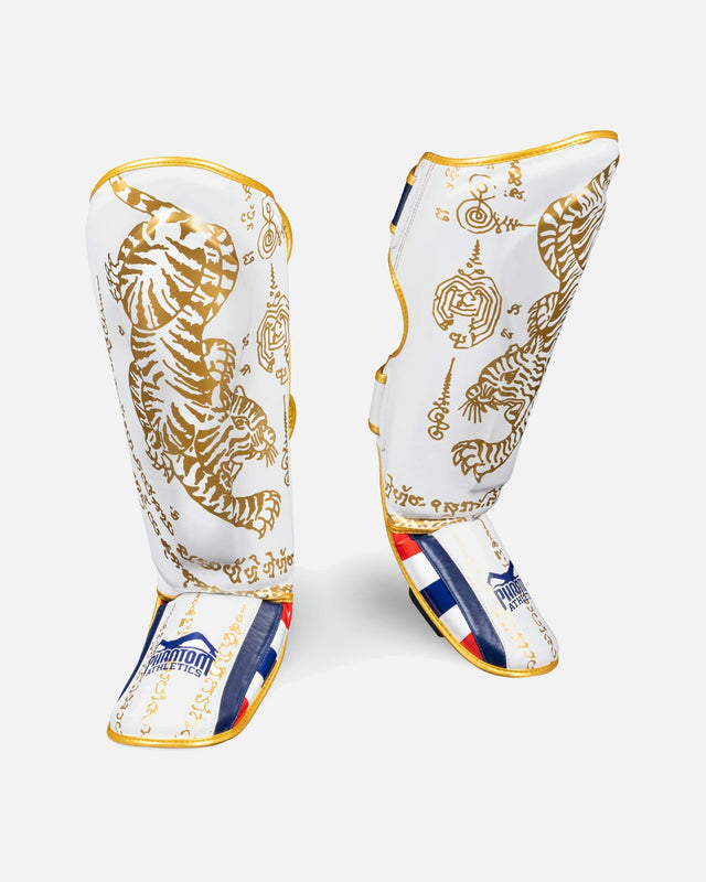 Espinilleras Phantom Athletics Muay Thai – Blanco/Oro