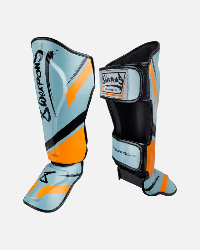 8 WEAPONS Schienbeinschoner Shift – Eisgrau/Orange